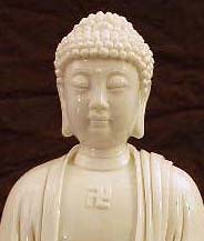 A Swastika Image On A Statue Of The Buddha