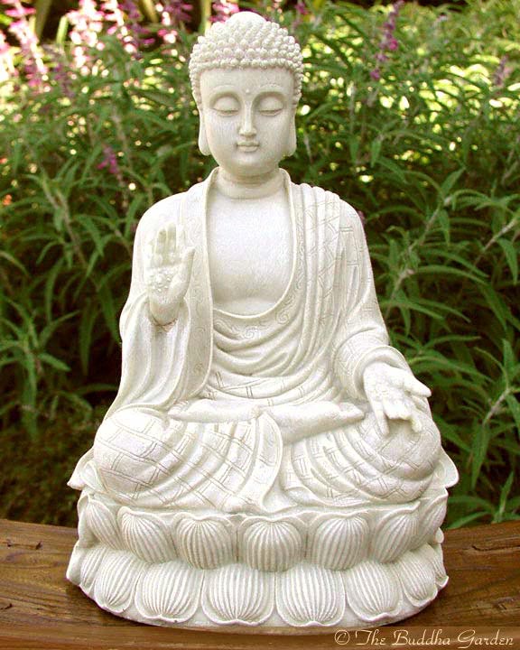 Large white buddha statue in sitting pose, in fine art photograph